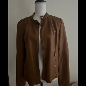 Women’s black rivet size L faux leather Zip front and sleek jacket lined